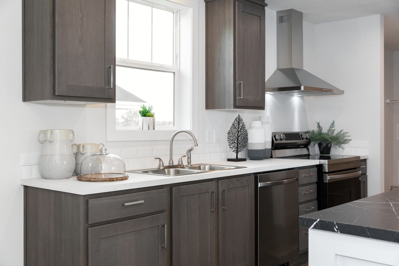 The ECLIPSE/6028-MS063 Kitchen. This Manufactured Mobile Home features 3 bedrooms and 2 baths.