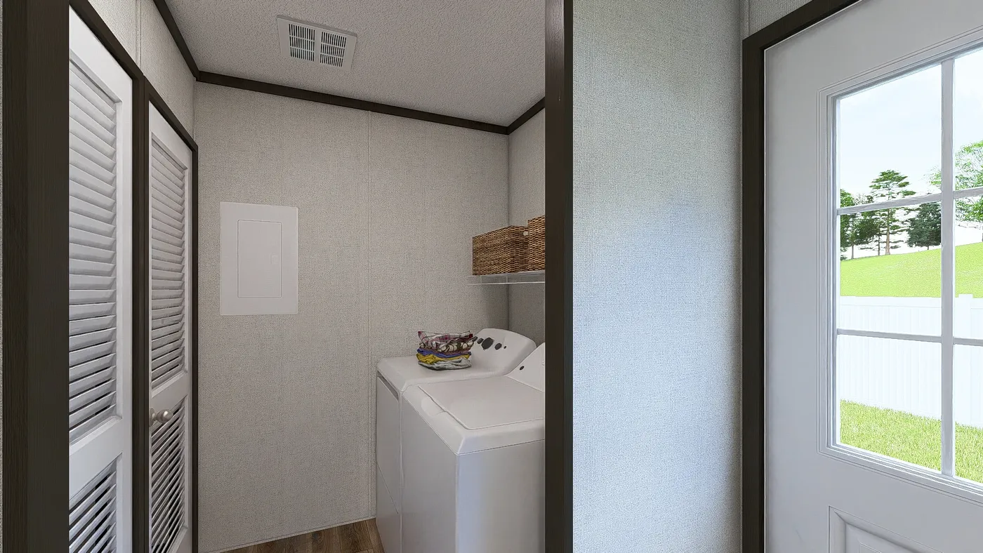 The ESSENCE Utility Room. This Manufactured Mobile Home features 3 bedrooms and 2 baths.