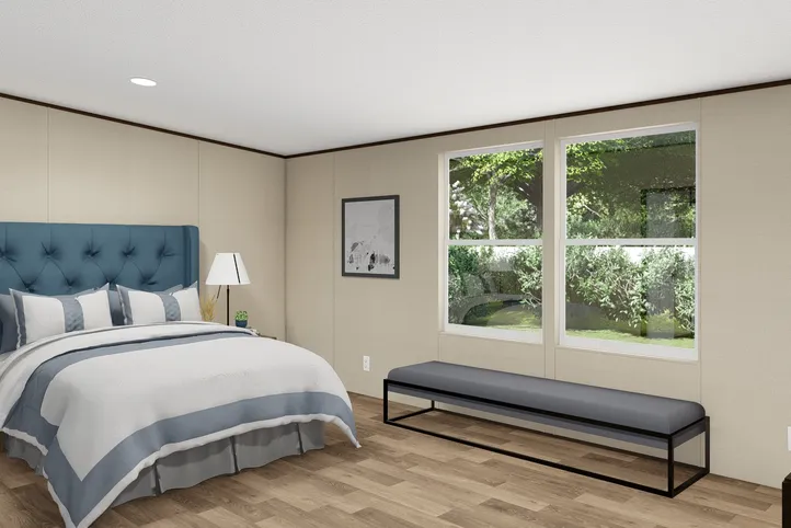 The PRIDE Primary Bedroom. This Manufactured Mobile Home features 4 bedrooms and 2 baths.