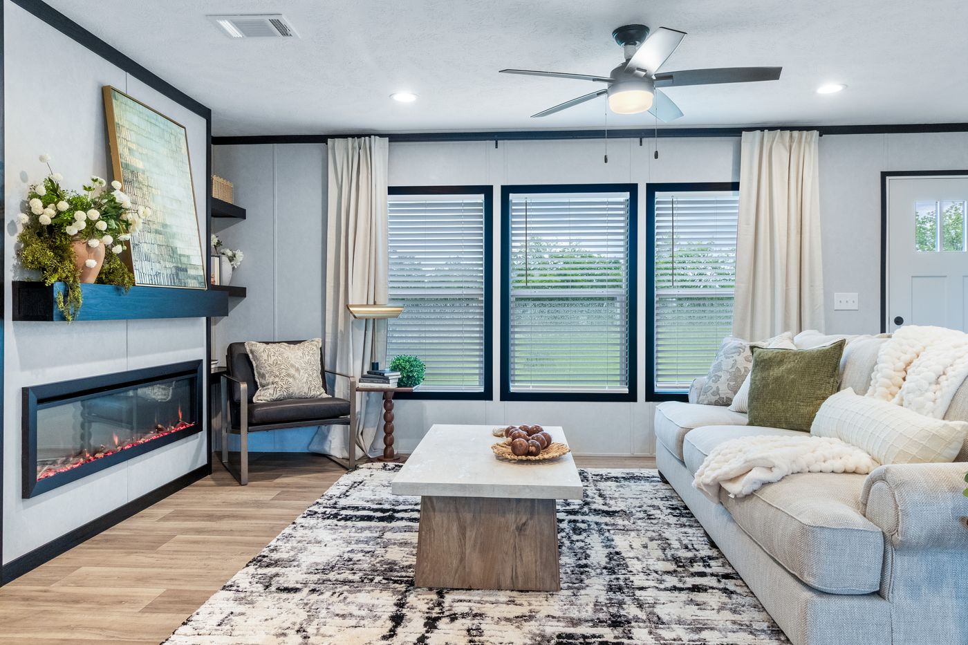 The ODYSSEY Living Room. This Manufactured Mobile Home features 4 bedrooms and 2 baths.