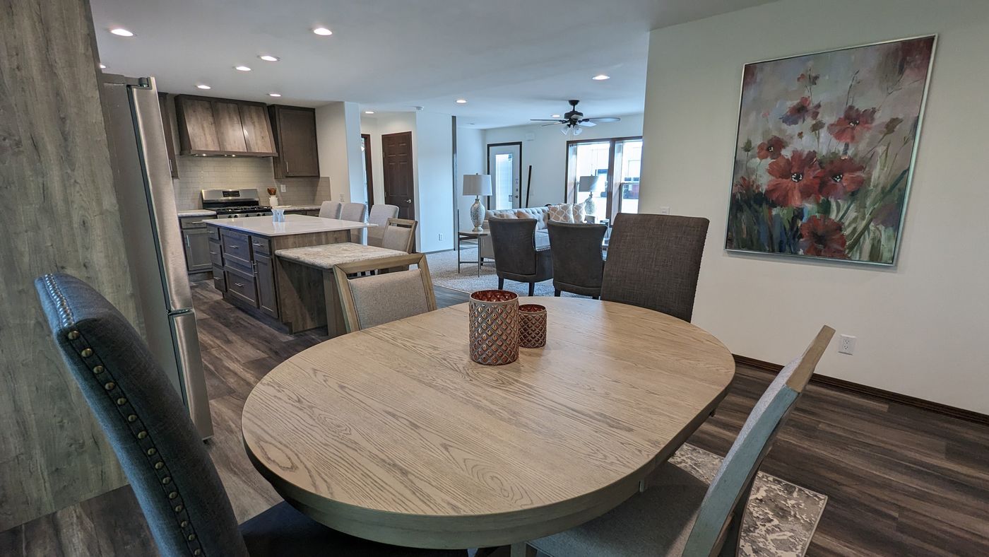 The LEGEND 327-1 Dining Room. This Manufactured Mobile Home features 3 bedrooms and 2 baths.