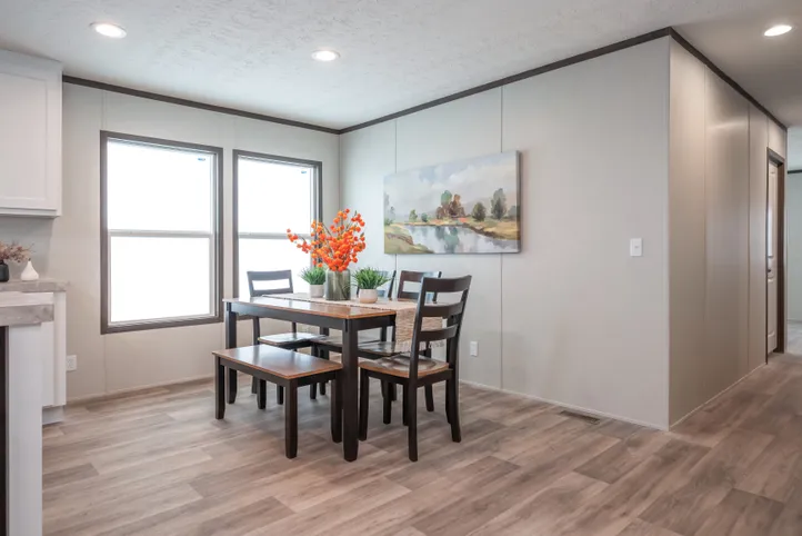 The EMPOWER Dining Room. This Manufactured Mobile Home features 4 bedrooms and 2 baths.