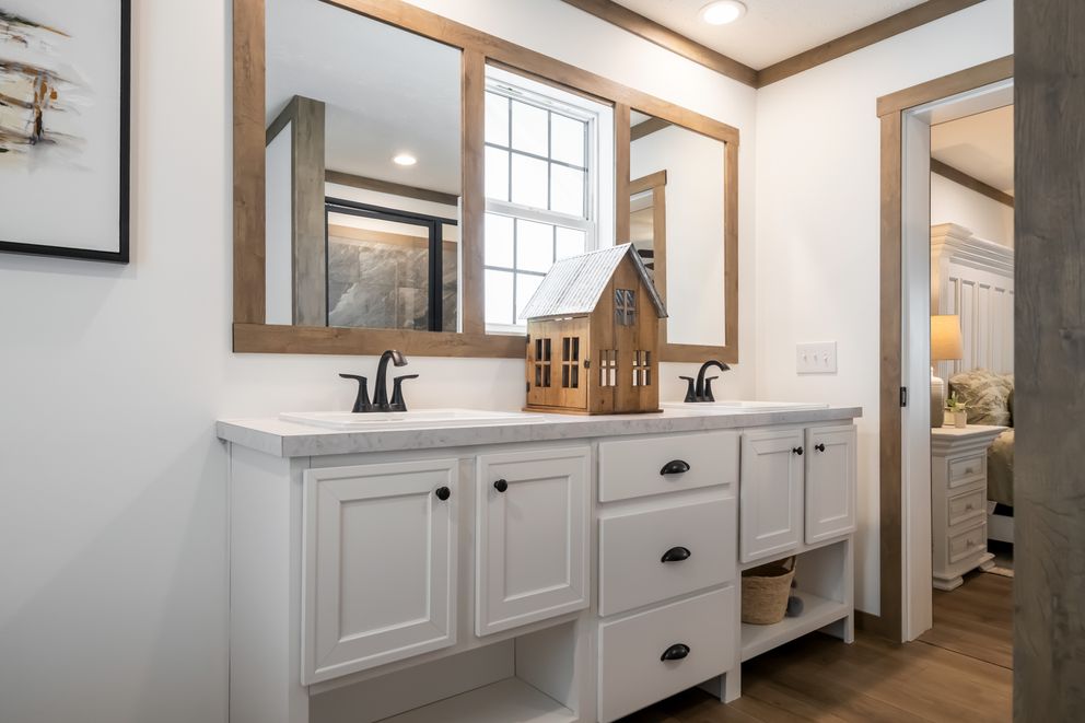 The THE LIZZIE Primary Bathroom. This Manufactured Mobile Home features 3 bedrooms and 2 baths.