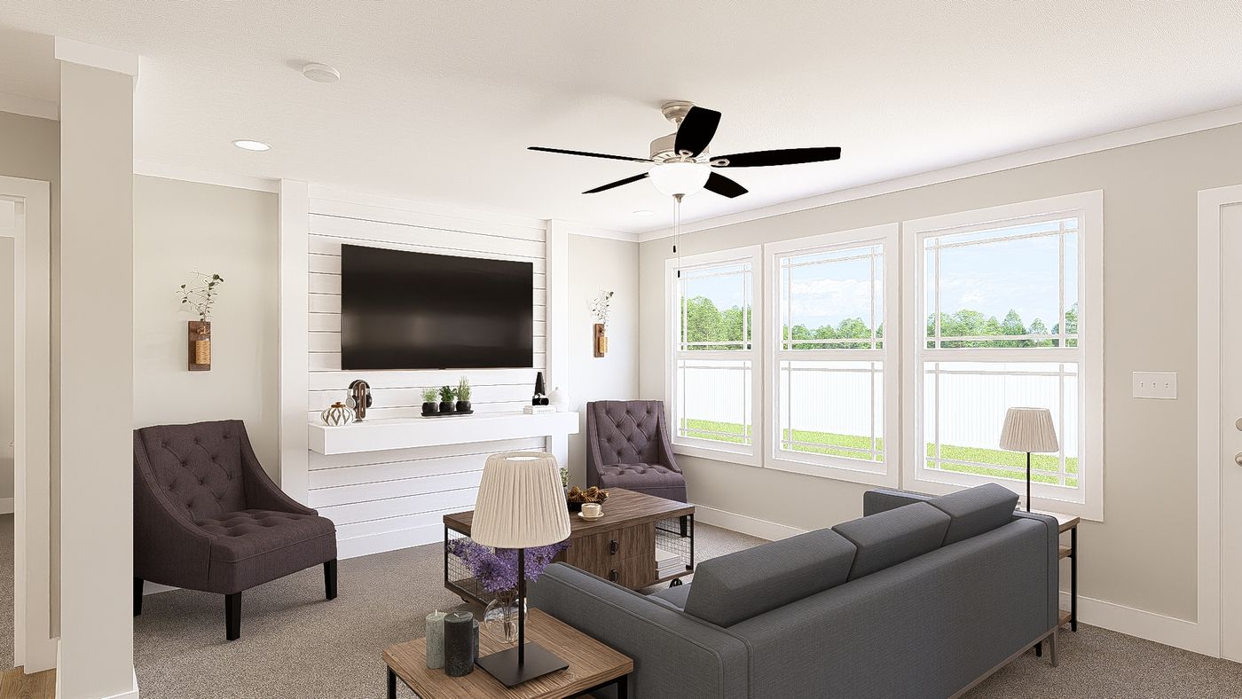 The THE BREEZE 64 Living Room. This Manufactured Mobile Home features 4 bedrooms and 2 baths.