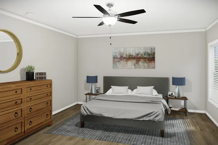 The HUXTON II Primary Bedroom. This Manufactured Mobile Home features 4 bedrooms and 2 baths.