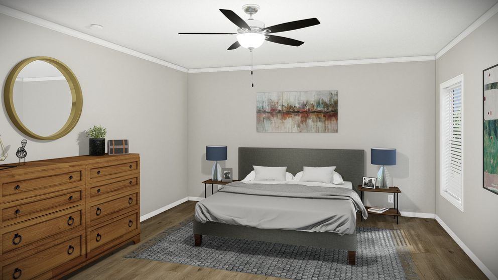 The HUXTON II Primary Bedroom. This Manufactured Mobile Home features 4 bedrooms and 2 baths.