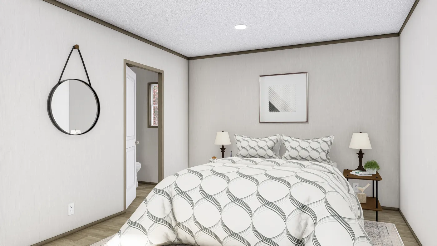 The LEWIS Primary Bedroom. This Manufactured Mobile Home features 2 bedrooms and 2 baths.