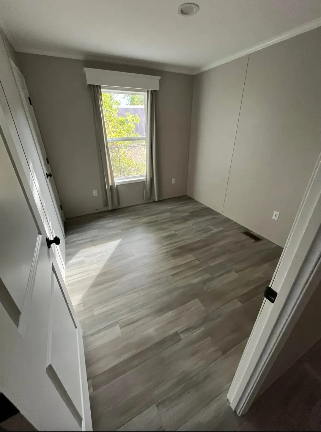 The PERIDOT 60 Guest Bedroom. This Manufactured Mobile Home features 2 bedrooms and 2 baths.