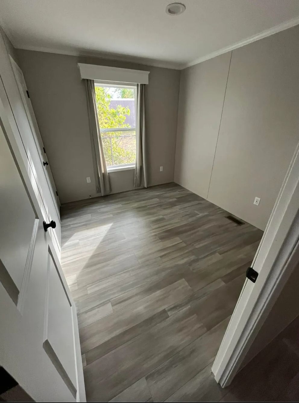 The PERIDOT 60 Guest Bedroom. This Manufactured Mobile Home features 2 bedrooms and 2 baths.