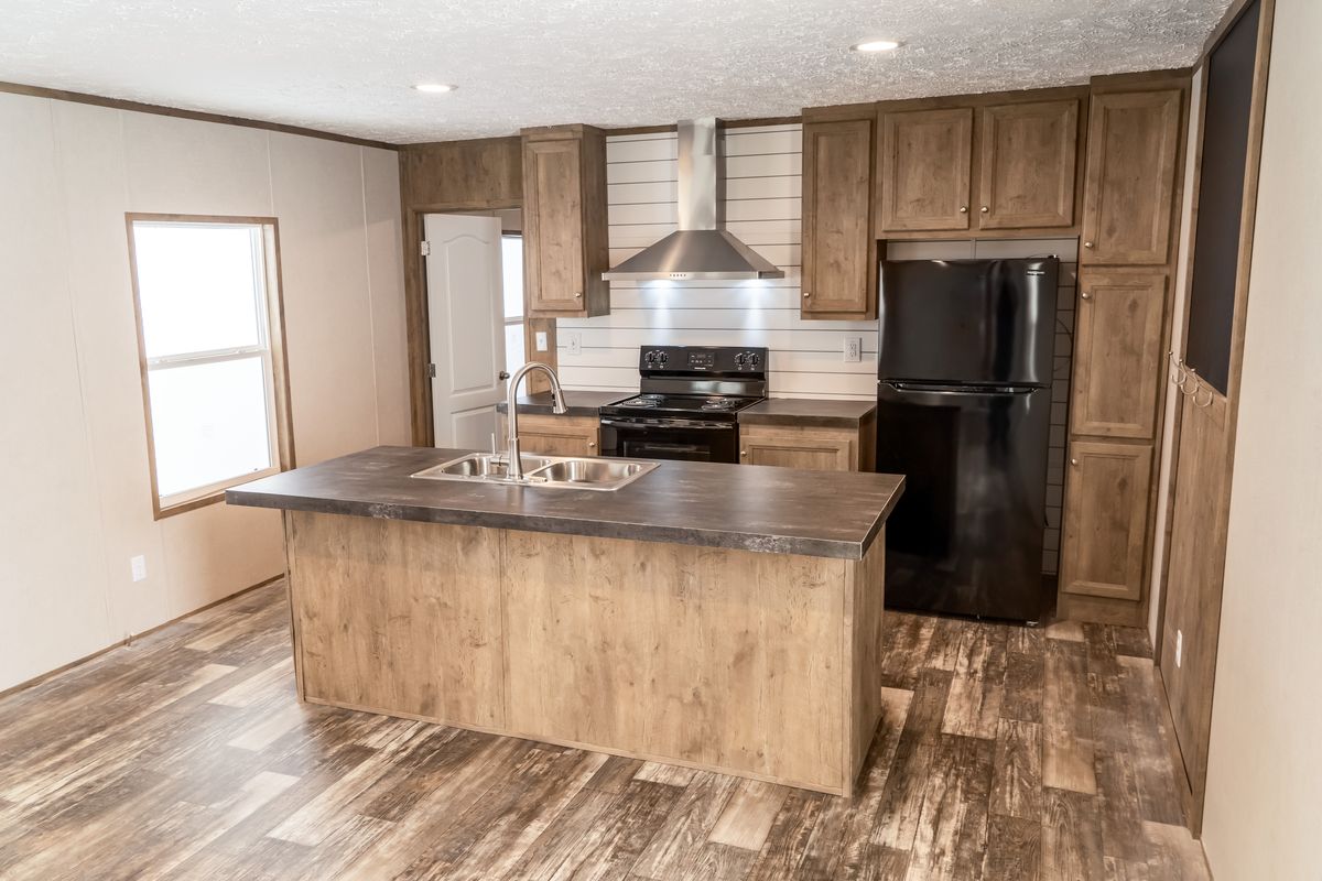 The THE BREEZE Exterior. This Manufactured Mobile Home features 3 bedrooms and 2 baths.