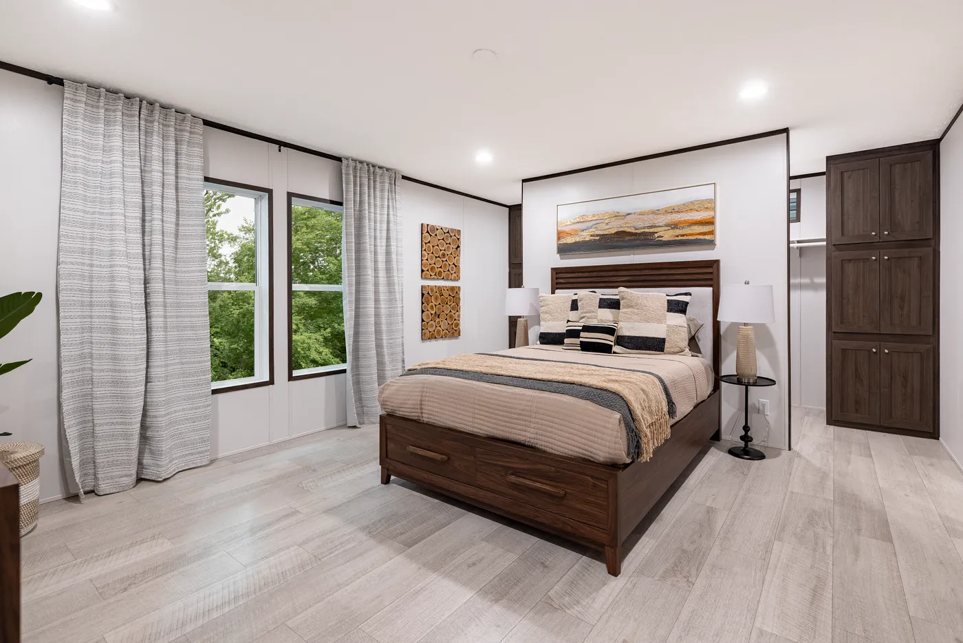 The CRESTWOOD Primary Bedroom. This Manufactured Mobile Home features 3 bedrooms and 2 baths.