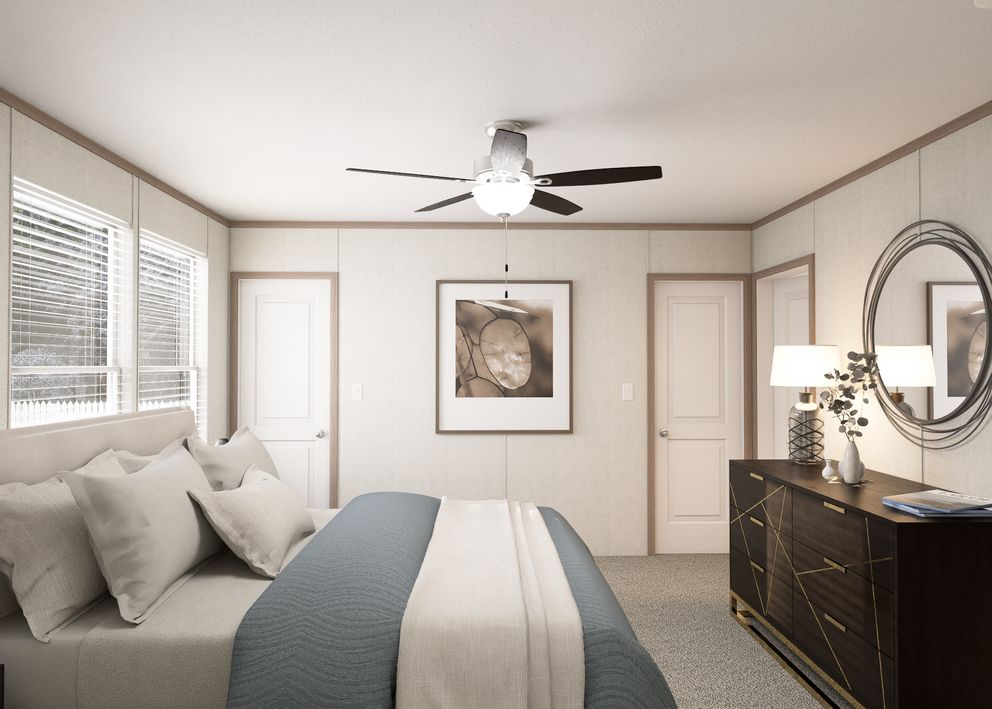 The THE RESERVE 60 Primary Bedroom. This Manufactured Mobile Home features 3 bedrooms and 2 baths.