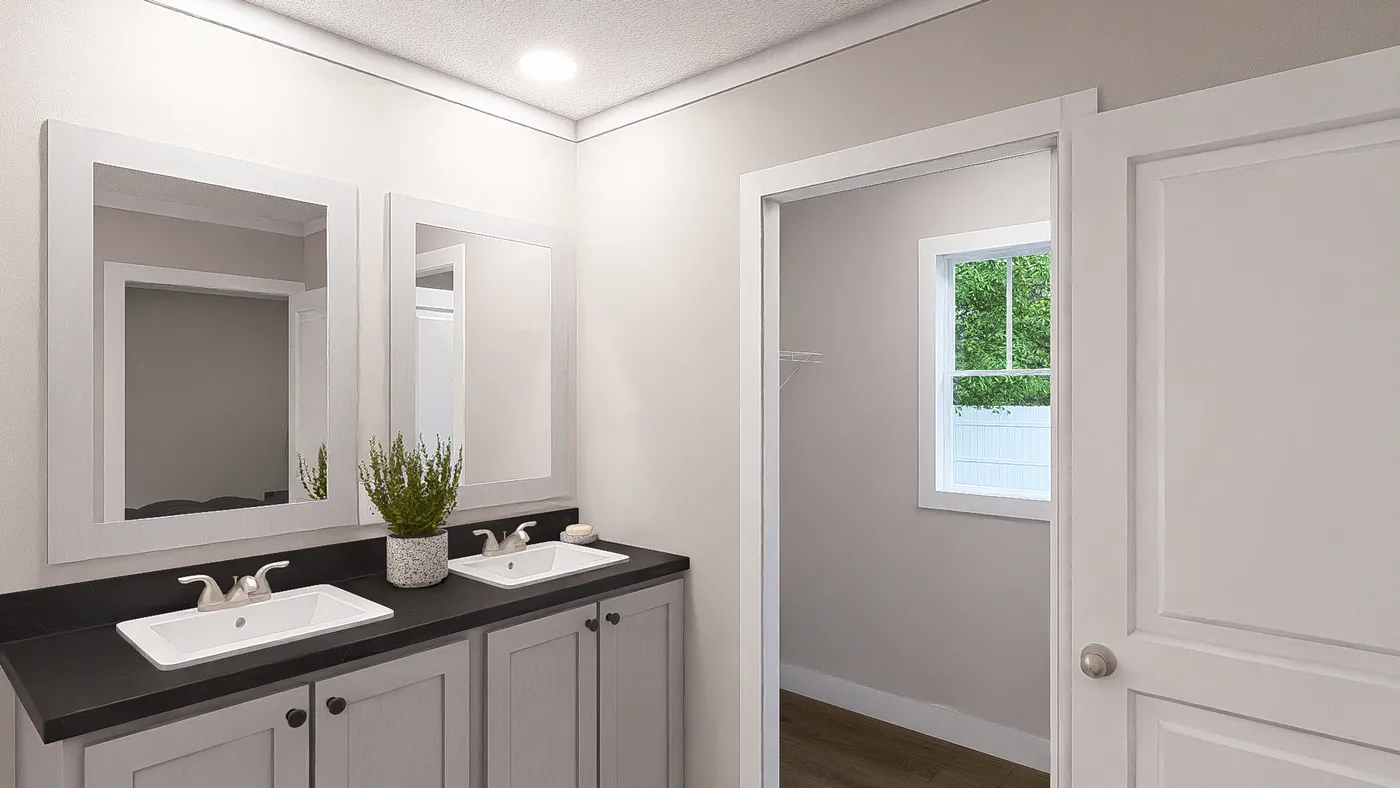 The SWEET CAROLINE Primary Bathroom. This Manufactured Mobile Home features 3 bedrooms and 2 baths.
