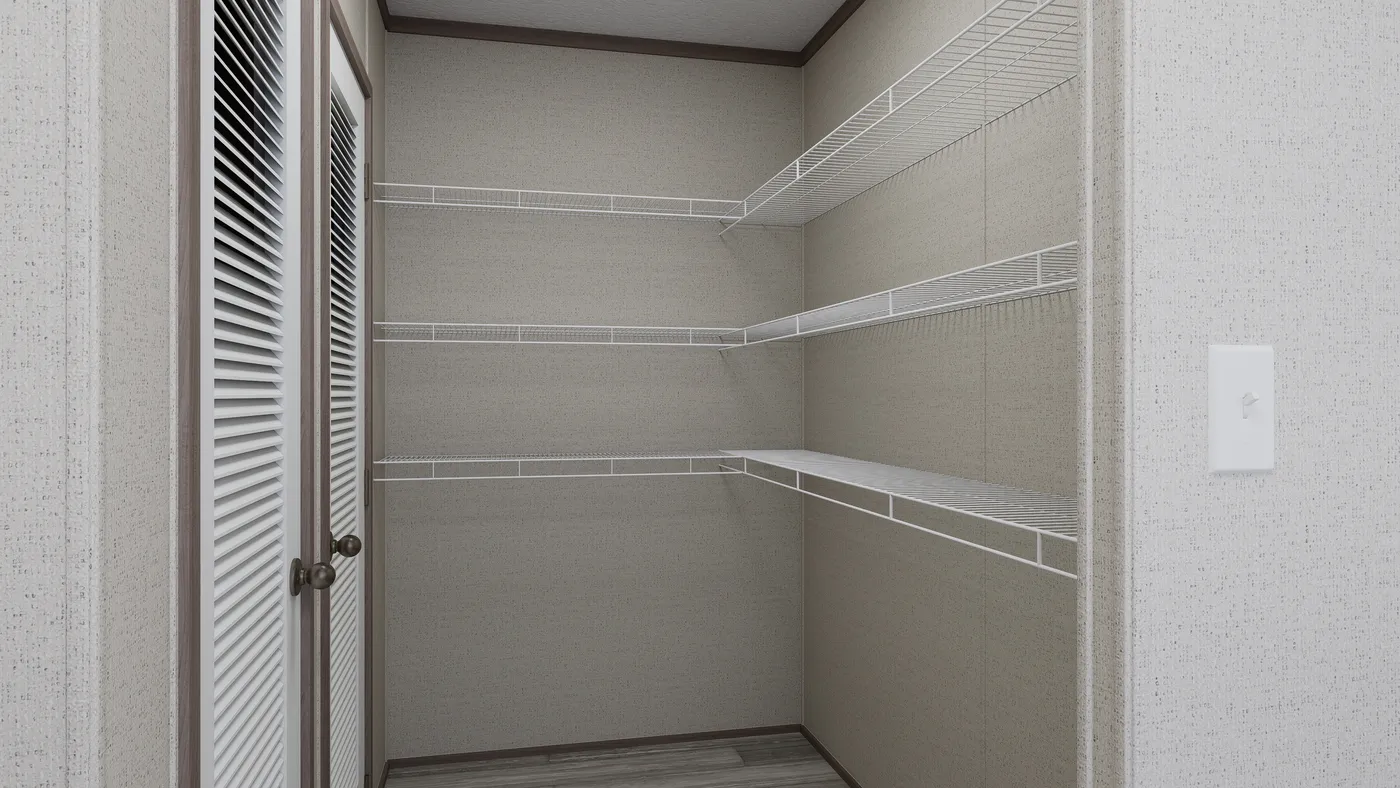 The THE MOUNTAINEER 60 Utility Room. This Manufactured Mobile Home features 3 bedrooms and 2 baths.