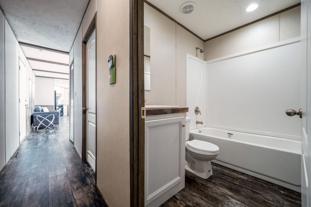 The ANNIVERSARY ENTERTAINER Exterior. This Manufactured Mobile Home features 3 bedrooms and 2 baths.