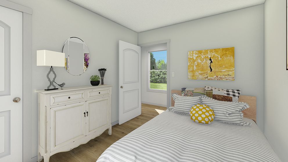 The SOLSBURY HILL 7616 TEMPO Bedroom. This Manufactured Mobile Home features 3 bedrooms and 2 baths.