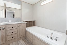 The THE ANNIVERSARY ISLANDER Primary Bathroom. This Manufactured Mobile Home features 3 bedrooms and 2 baths.