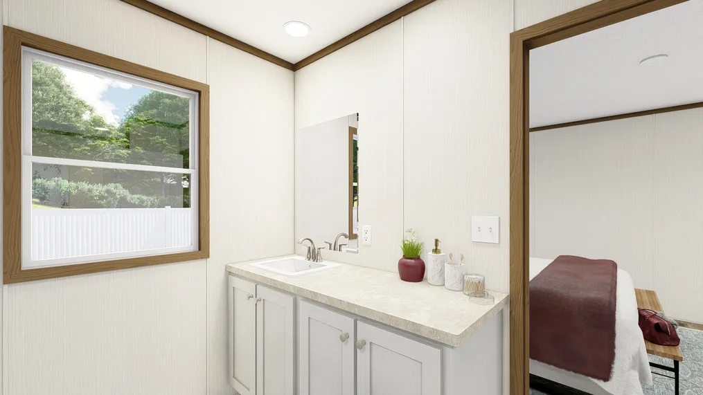 The THE ESSENCE Primary Bathroom. This Manufactured Mobile Home features 3 bedrooms and 2 baths.