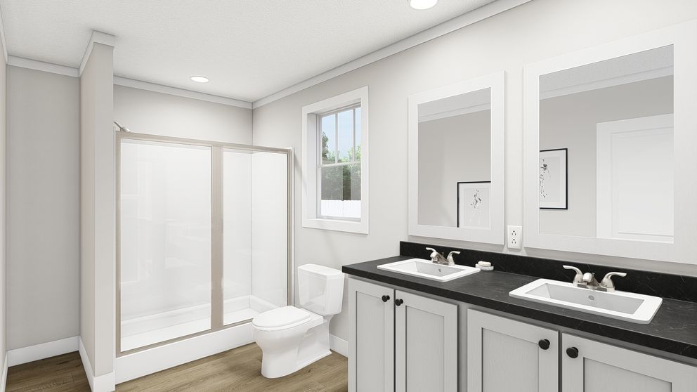 The UNDER PRESSURE Primary Bathroom. This Manufactured Mobile Home features 3 bedrooms and 2 baths.