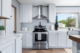The EL SUENO BREEZE Kitchen. This Manufactured Mobile Home features 4 bedrooms and 2 baths.