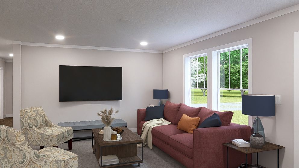 The LEAN ON ME Living Room. This Manufactured Mobile Home features 3 bedrooms and 2 baths.