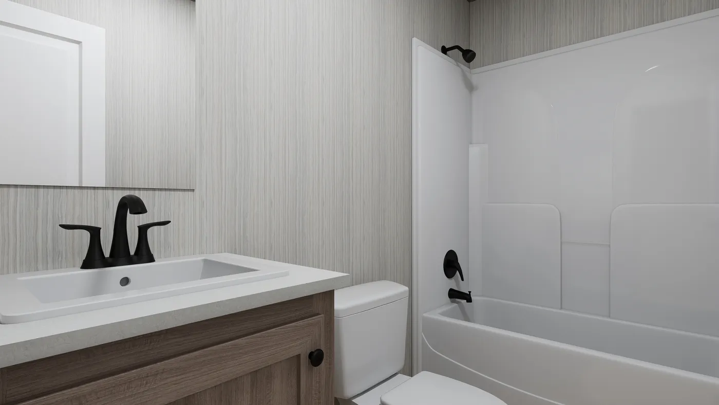 The THE ANNIVERSARY 76 Guest Bathroom. This Manufactured Mobile Home features 3 bedrooms and 2 baths.