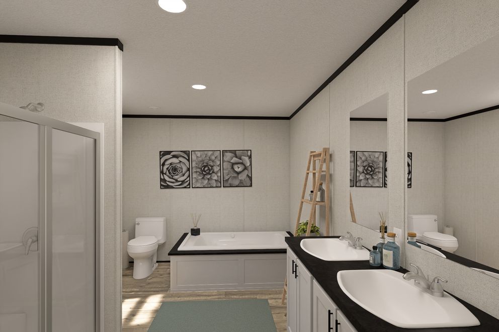 The THE MOUNTAINEER 48 Primary Bathroom. This Manufactured Mobile Home features 3 bedrooms and 2 baths.