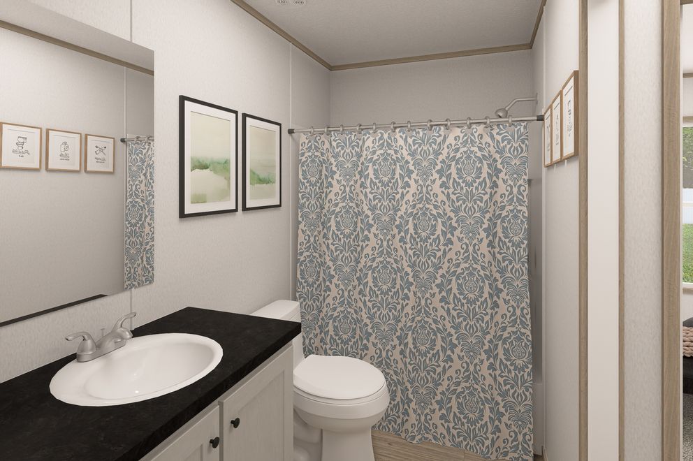 The THE EAGLE 48 Guest Bathroom. This Manufactured Mobile Home features 3 bedrooms and 2 baths.