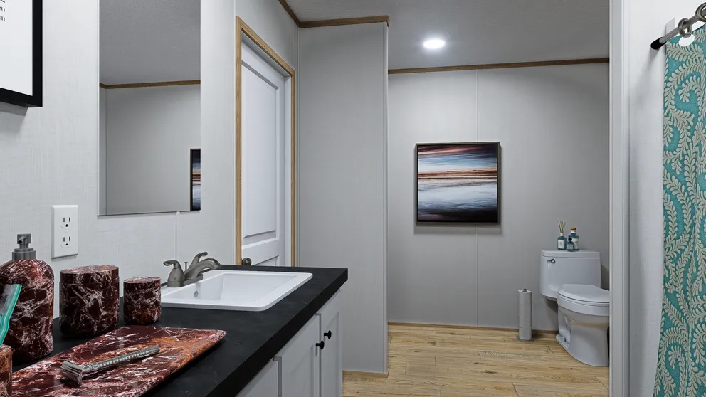 The SOLACE Primary Bathroom. This Manufactured Mobile Home features 4 bedrooms and 2 baths.