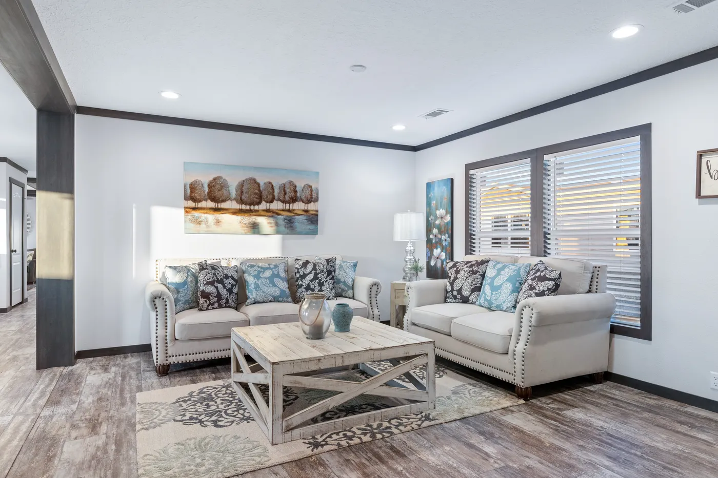 The BOUJEE XL Living Room. This Manufactured Mobile Home features 4 bedrooms and 3 baths.