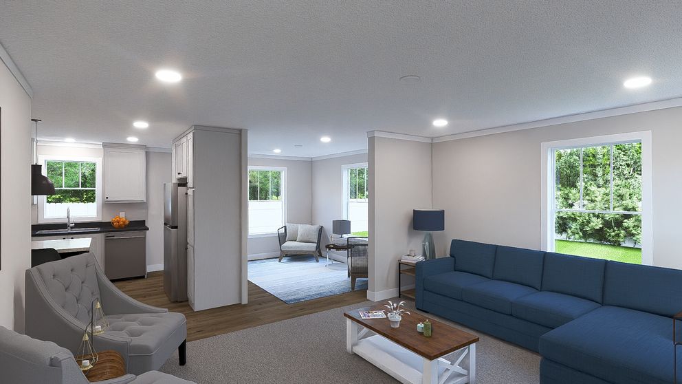 The UNDER PRESSURE Living Room. This Manufactured Mobile Home features 3 bedrooms and 2 baths.