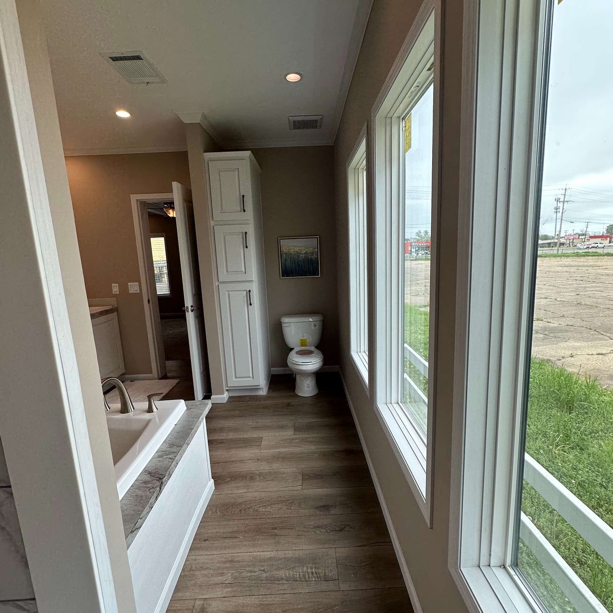 The THE HEXAGON Primary Bathroom. This Manufactured Mobile Home features 4 bedrooms and 3 baths.