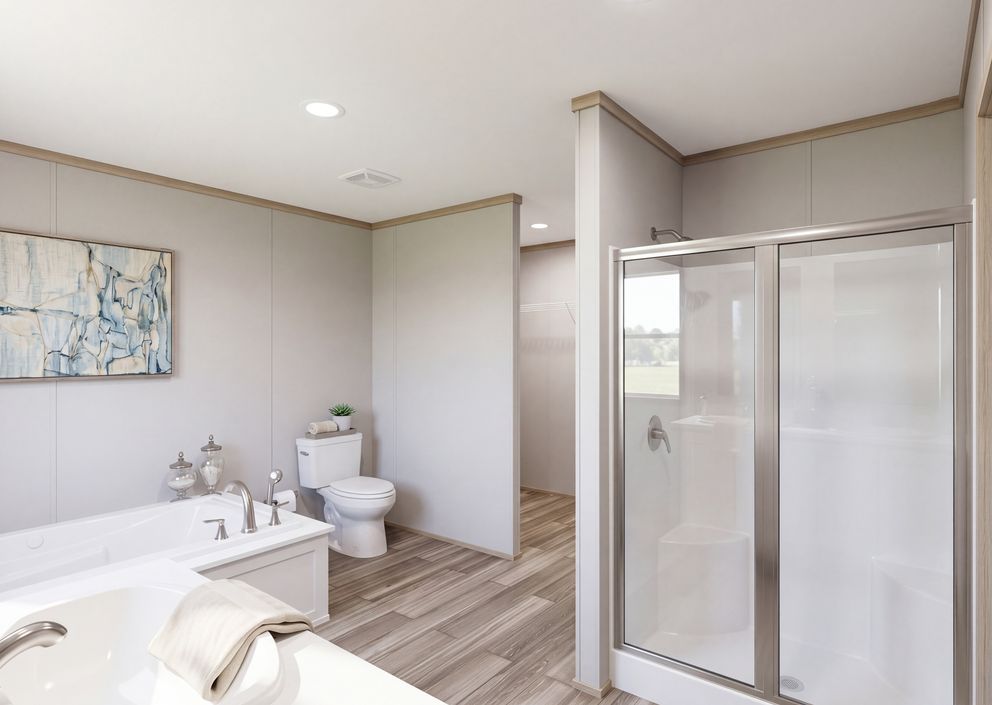 The THE MOUNTAINEER 76 Primary Bathroom. This Manufactured Mobile Home features 4 bedrooms and 2 baths.