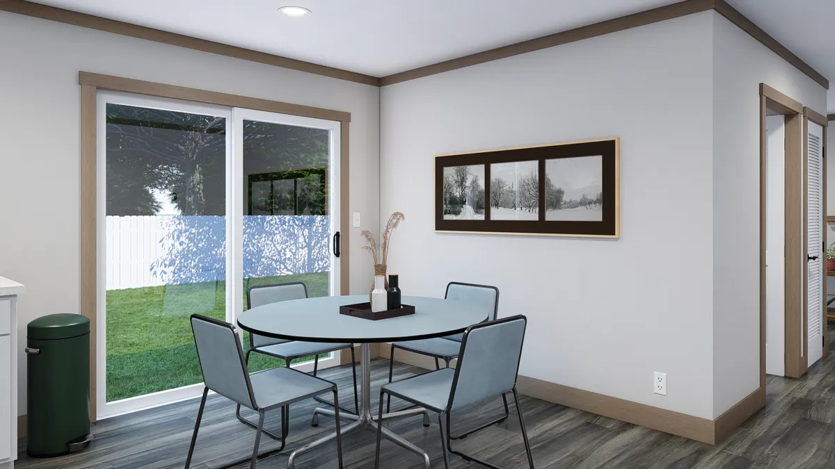 The WILDER Dining Area. This Manufactured Mobile Home features 3 bedrooms and 2 baths.