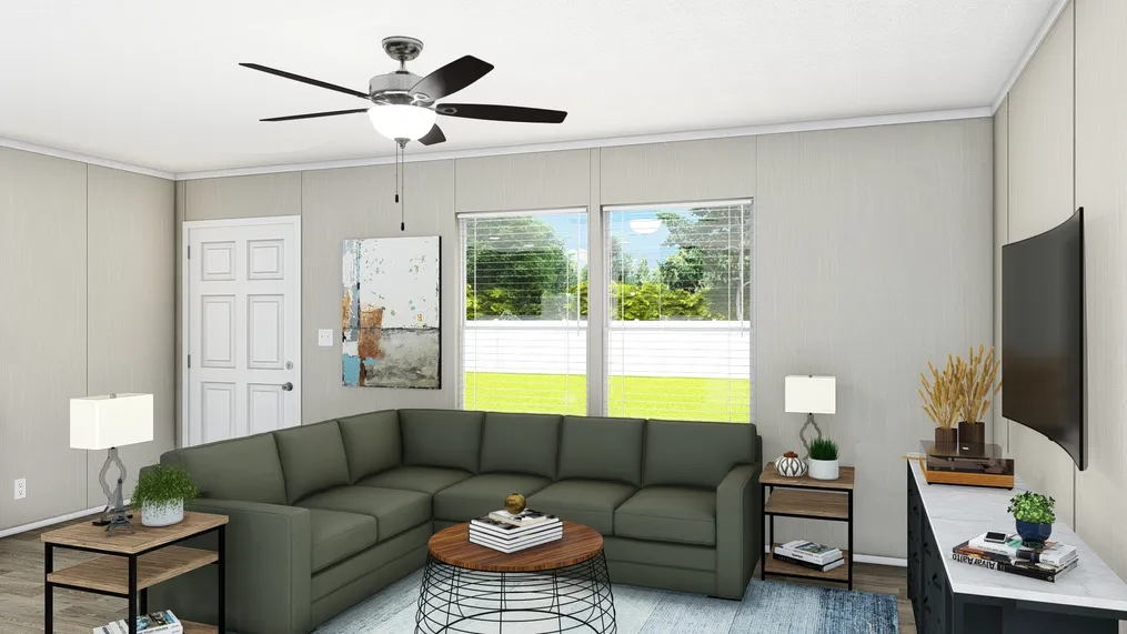 The TRADITION 60B Living Room. This Manufactured Mobile Home features 3 bedrooms and 2 baths.