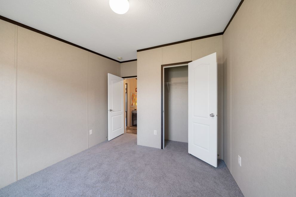 The GARNET Guest Bedroom. This Manufactured Mobile Home features 3 bedrooms and 2 baths.