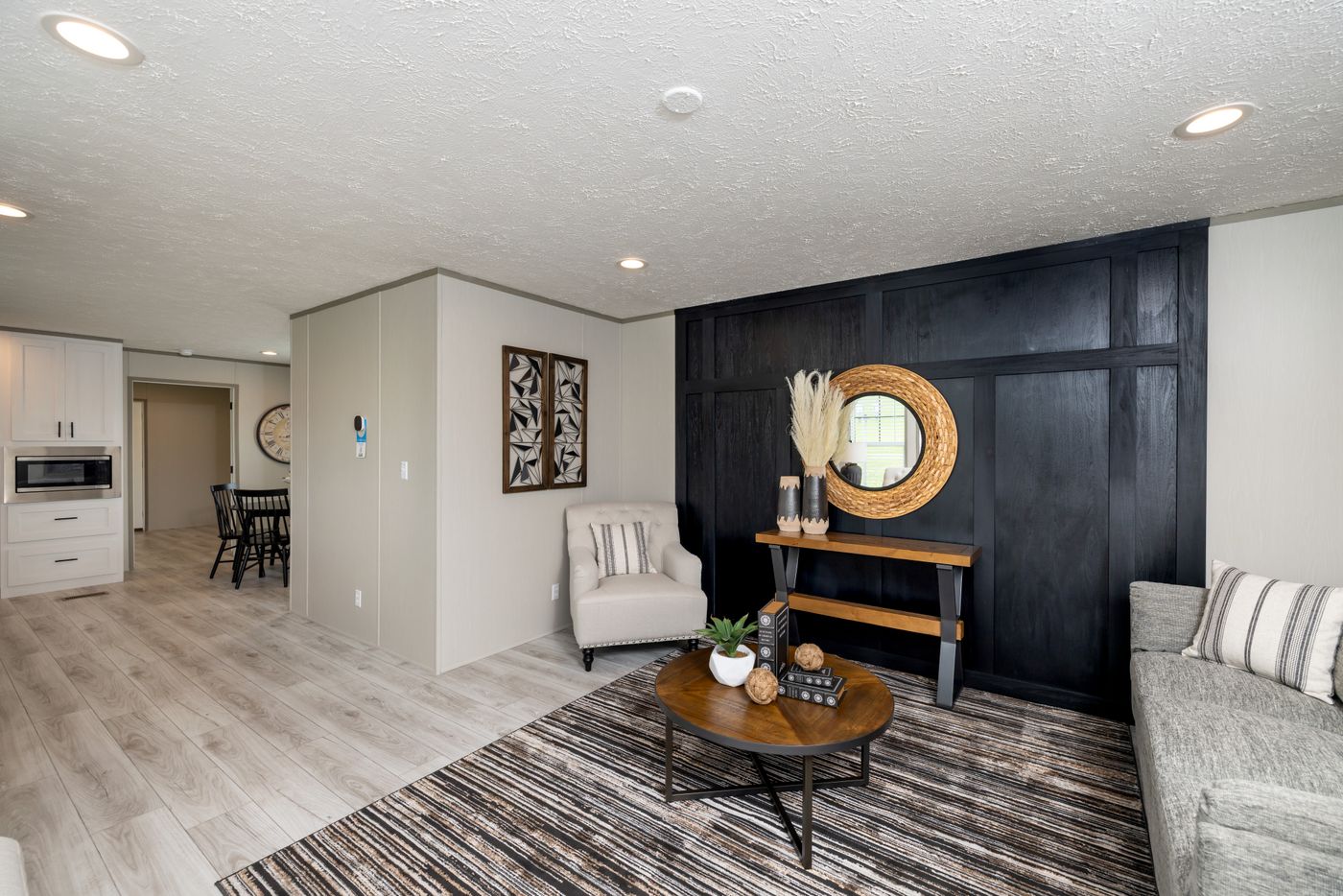 The SHOWER HOUSE Living Room. This Manufactured Mobile Home features 3 bedrooms and 2 baths.