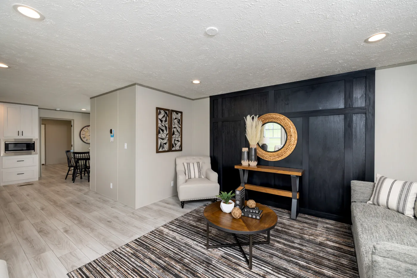 The SHOWER HOUSE Living Room. This Manufactured Mobile Home features 3 bedrooms and 2 baths.