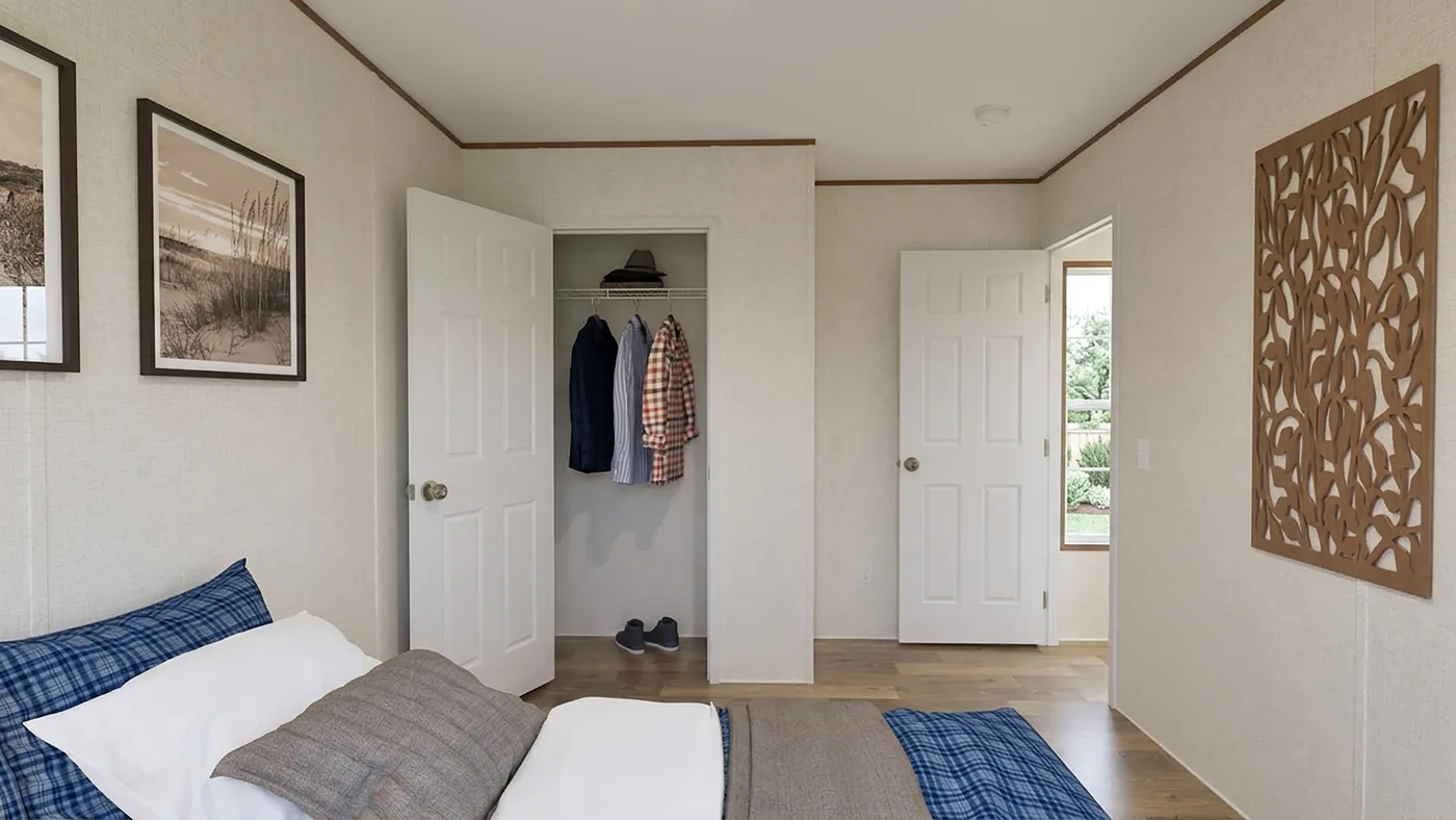 The MAPLE Guest Bedroom. This Manufactured Mobile Home features 3 bedrooms and 2 baths.