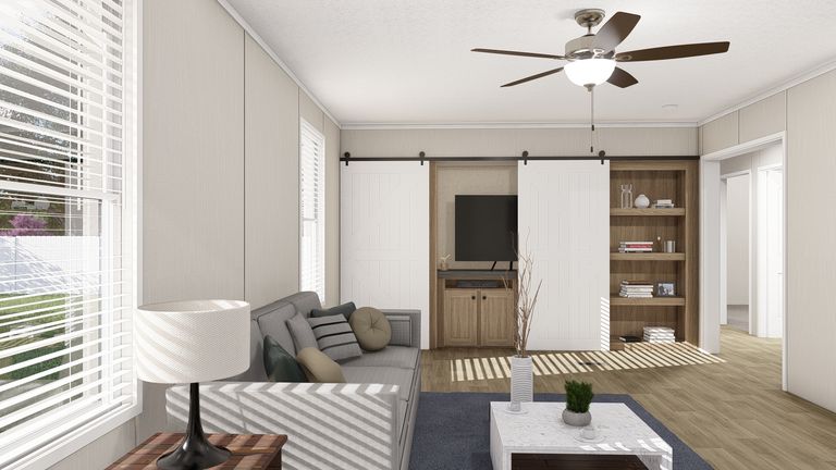 The THE RESERVE 76 Living Room. This Manufactured Mobile Home features 4 bedrooms and 2 baths.