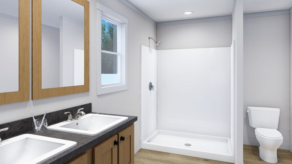 The SUPERFLY Primary Bathroom. This Manufactured Mobile Home features 5 bedrooms and 2 baths.