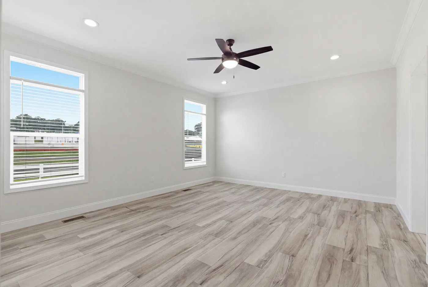 The THE SUMMIT Primary Bedroom. This Manufactured Mobile Home features 3 bedrooms and 2 baths.