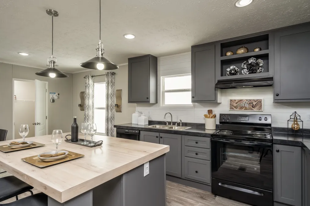 The TRADITION 60B Kitchen. This Manufactured Mobile Home features 3 bedrooms and 2 baths.