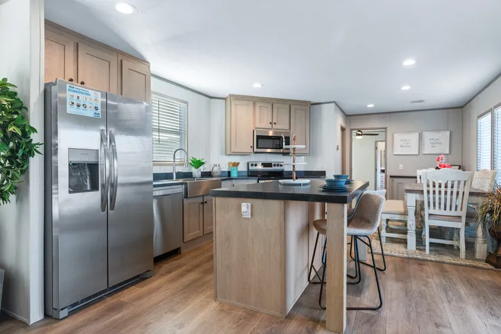 The RESOLUTION 16763J Kitchen. This Manufactured Mobile Home features 3 bedrooms and 2 baths.