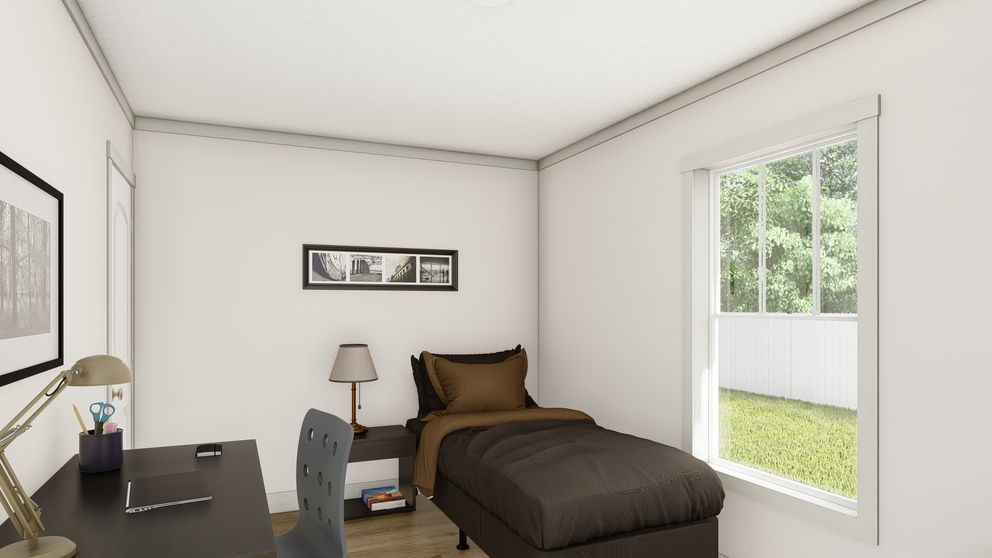 The SWEET CAROLINE Guest Bedroom. This Manufactured Mobile Home features 3 bedrooms and 2 baths.