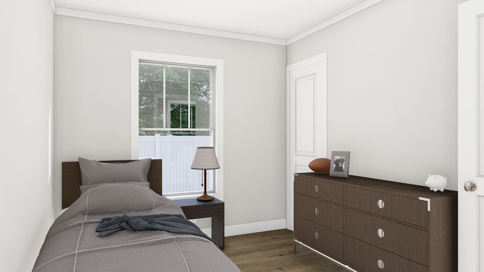 The RHYTHM NATION Guest Bedroom. This Manufactured Mobile Home features 3 bedrooms and 2 baths.