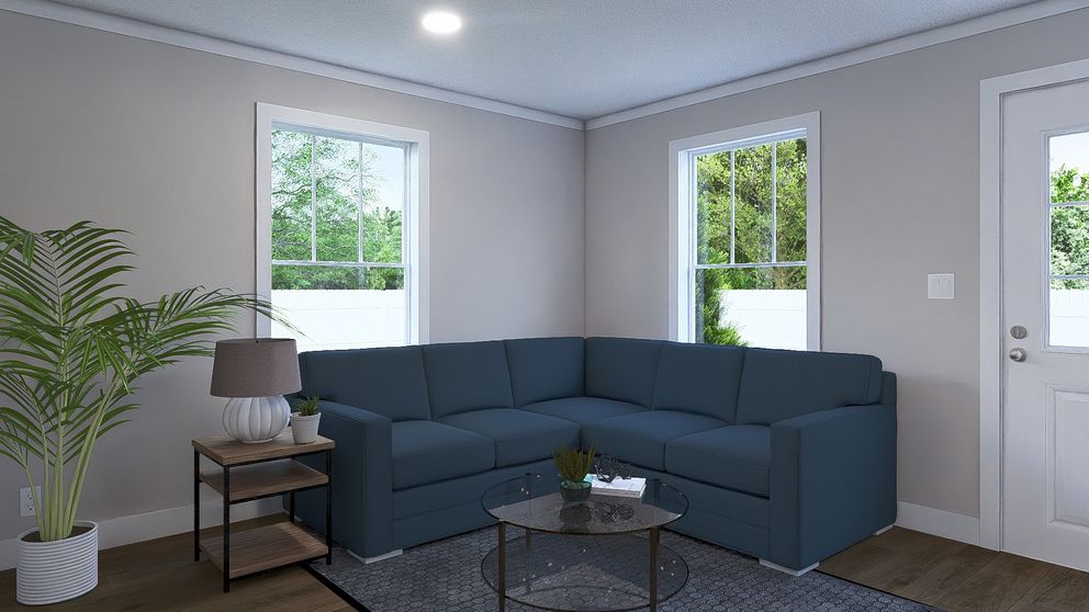 The ROCKET MAN Living Room. This Manufactured Mobile Home features 3 bedrooms and 2 baths.