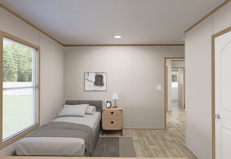 The THE MOUNTAINEER 72 Guest Bedroom. This Manufactured Mobile Home features 3 bedrooms and 2 baths.