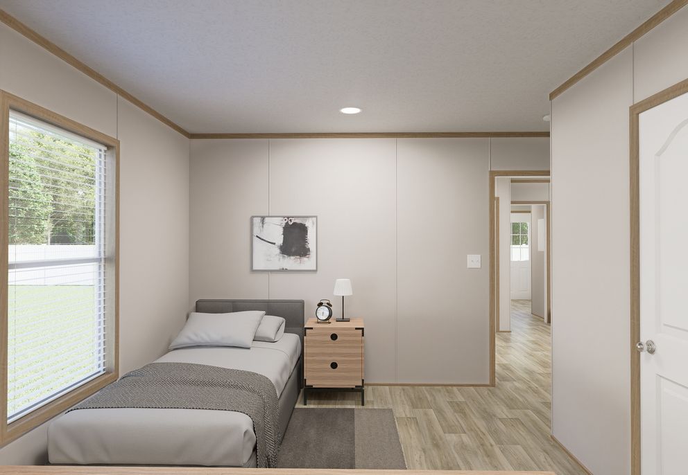 The THE MOUNTAINEER 72 Guest Bedroom. This Manufactured Mobile Home features 3 bedrooms and 2 baths.