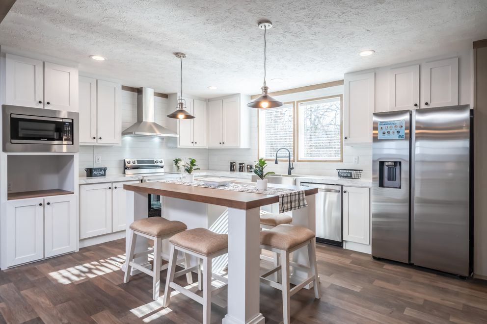 The FARMHOUSE BREEZE 72 Kitchen. This Manufactured Mobile Home features 4 bedrooms and 2 baths.